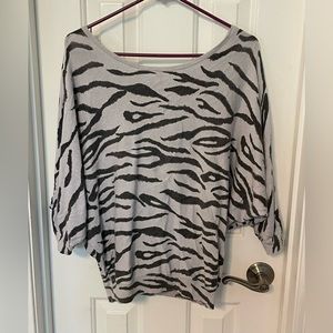 Lite periwinkle and gray zebra print. Off the shoulders top. Size 6.